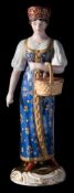 Two Gardner (Moscow) porcelain figures of a Berry Picker and a Coachman: the former wearing a blue