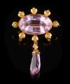 A gold, pink topaz and diamond brooch: the oval pink topaz 11.8mm wide x 18.