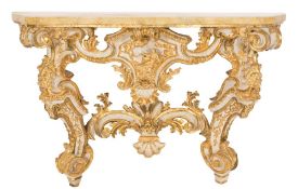An Italian carved giltwood and decorated console table:, of serpentine outline in the Rococo taste,