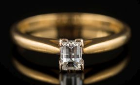 An 18ct gold and baguette-cut diamond single-stone ring: estimated to weigh 0.