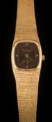 A lady's 18ct gold 'Certina' quartz wristwatch: the cushion-shaped dial with dot markers in an 18ct