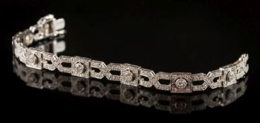 A diamond mounted Art Deco-style bracelet: of square and lozenge-shaped linking,