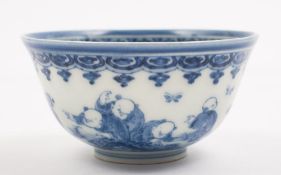 A Chinese porcelain bowl: of circular mildly everted form painted in blue with five boys and a fir