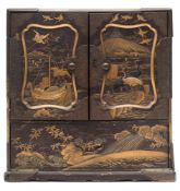 A Japanese metal mounted and gilt lacquered Kodansu: of rectangular form with a pair of panelled