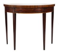 A George III mahogany crossbanded and inlaid half round tea table:, bordered with boxwood lines,