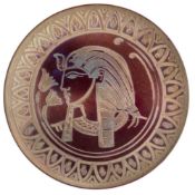 A Burmantofts pottery wall plaque by Joseph Walmsley: of circular form painted in metallic lustres