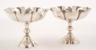 A pair of Edward VII silver pedestal sweetmeat dishes,