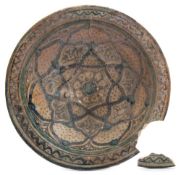 A 19th century Moroccan pottery bowl: of circular form painted with geometric designs in blues and