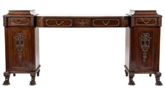 By Druce & Co - An Edwardian carved mahogany pedestal sideboard:, decorated with bands of foliage,