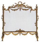A French gilt brass fire screen:, surmounted by a laurel leaf garland,
