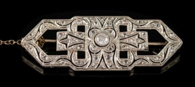 An Art Deco 18ct white gold and diamond mounted rectangular brooch: of openwork design with