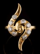 A diamond mounted 'snake-like' cluster ring: with eight circular brilliant-cut diamonds estimated