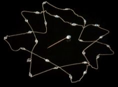A silver and moonstone long chain necklace: of trace linking interspersed with round and oval