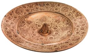A Spanish Hispano-Moresque lustre pottery dish: with pronounced spiral fluted central boss,