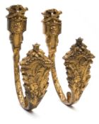 A pair of 19th century ormolu curtain tie backs: of U-shaped outline,