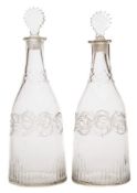 A pair of Irish mould blown decanters: each of mallet shaped form with a fret cut lozenge shaped