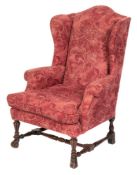 A carved walnut frame wing armchair:, in the William and Mary taste,