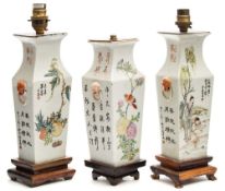 A pair of Chinese porcelain vases and one similar: each of square shouldered profile with mask and