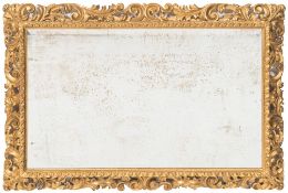 A carved giltwood rectangular Florentine frame mirror:,