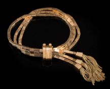 A three-strand bracelet of rectangular tube-like linking:, each strand with tassel terminal,
