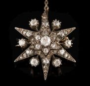 A late 19th century gold, silver and diamond six-pointed star brooch: 32mm wide,
