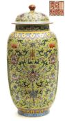 A Chinese porcelain jar and cover: of slender oviform decorated in the famille rose palette with