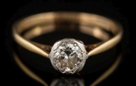 A gold and diamond solitaire ring: the old European-cut stone estimated to weigh 0.