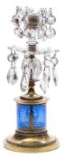 A Regency cut-glass and brass candlestick: the blue glass column gilded with classical figures