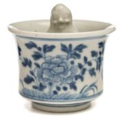 A Chinese blue and white porcelain 'surprise' cup: with flared rim and internal standing figure,
