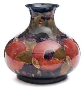 A Moorcroft pottery vase: of squat form with flaring neck,