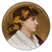 A Minton pottery plaque attributed to Herbert Wilson Foster: of circular form painted with a female