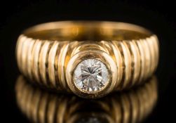 A modern diamond single-stone ring: the circular, brilliant-cut diamond approximately 0.