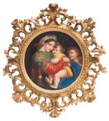 A Continental porcelain plaque: of circular form enamelled with the Madonna della Sedia after