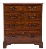 A Georgian mahogany chest:, of small size, the top with a moulded edge,