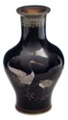 A small Japanese cloisonne baluster vase: decorated with two cranes on a midnight blue ground