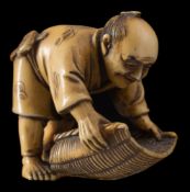 A Japanese carved ivory netsuke, signed Mitsuyuki: of a smiling man moving a large sieve, Meiji,