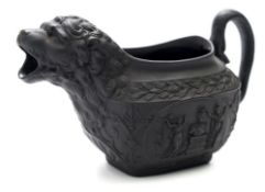 A black basalt 'Wellington' commemorative cream jug: of rounded rectangular form with serpent
