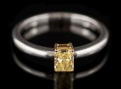 A yellow diamond solitaire ring: the rectangular yellow diamond 4.7mm long x 3.6mm wide x 2.