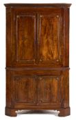 An 18th Century fruitwood and inlaid standing corner cupboard:,