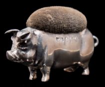 A George V silver pin cushion, maker Levi & Salaman, Birmingham, 1919: in the form of a pig, 5.5cm.