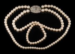 A graduated cultured pearl two-string necklace: with cultured pearls graduated from 4.5mm to 6.