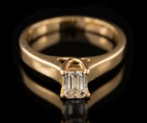 A baguette-cut diamond single-stone ring: estimated to weigh 0.60ct, in four-claw setting, 4.