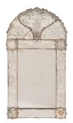 A 19th Century Venetian etched marginal wall mirror:, with shaped arched cresting and flowerhead,