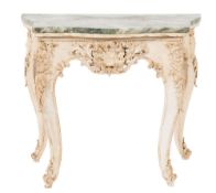 A carved and decorated console table:, of serpentine outline in the 18th Century Italian taste,