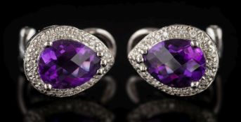 A pair of faceted pear-shaped amethyst and diamond surround ear clip/studs: each faceted amethyst