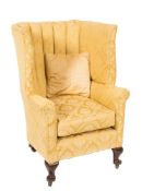 A Porters mahogany frame wing armchair:,