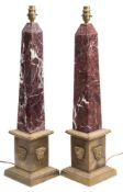 A pair of 19th century French gilt brass and marble obelisks: each of square tapering form with