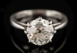 A diamond mounted single-stone ring: with a round old mine brilliant-cut stone approximately 8.6mm.