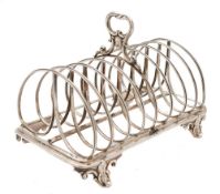 An early Victorian silver eight-division toast rack, unknown maker, London, 1842: crested,