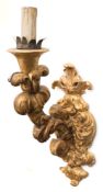 A pair of large wall mounted pricket candlesticks: of scrolling foliate design,